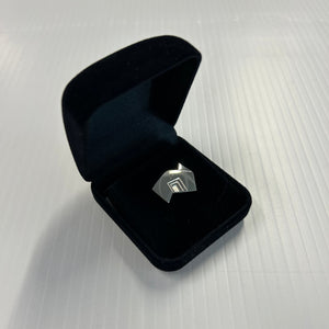 State Brand silver lapel pin
