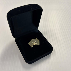 State Brand gold lapel pin